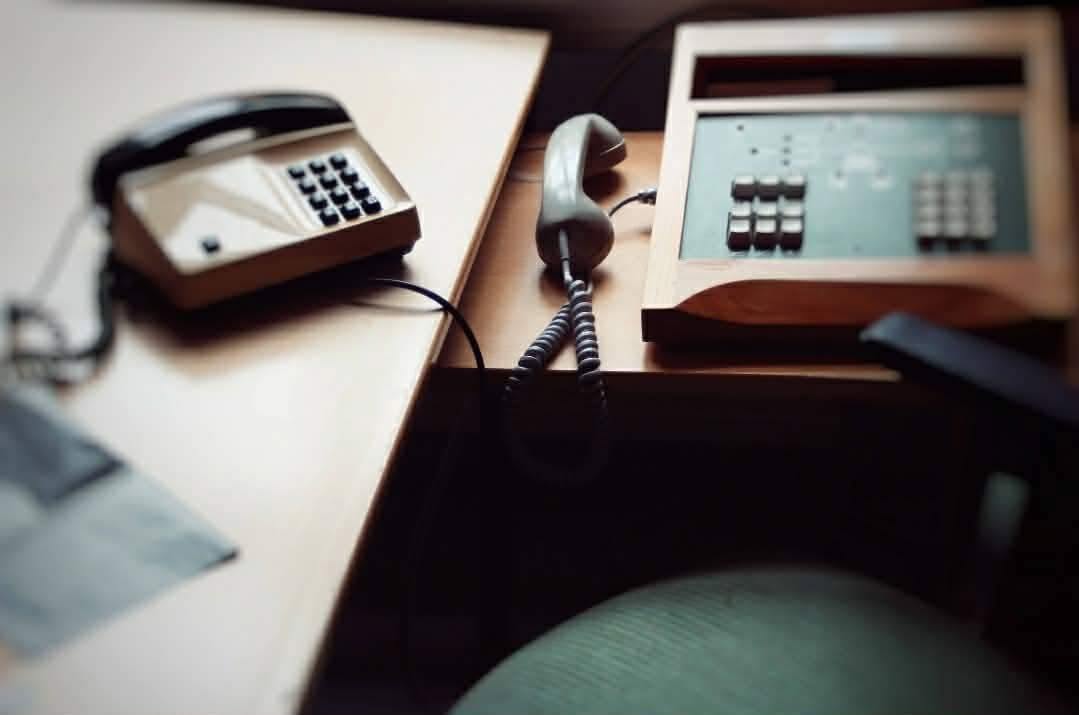 The switchboard, handset and keypad still on the desk